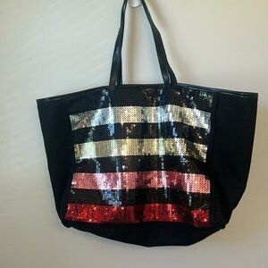 Victoria’s Secret tote bag with sequins on the front.